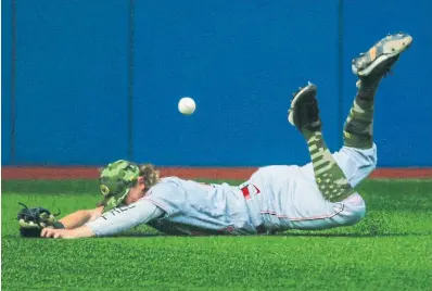  ?? RICK MADONIK TORONTO STAR ?? Reds left-fielder T.J. Friedl fails to come up with a ball hit by George Springer, who wound up being thrown out at second.