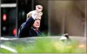  ?? PTI ?? Former President Donald Trump gestures as he departs Trump Tower, Wednesday, in New York, on his way to the New York attorney general's office for a deposition in a civil investigat­ion
