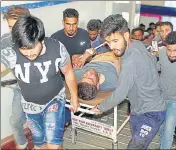  ?? PTI ?? A civilian who was injured in clashes during Pulwama encounter being taken to SMHS hospital in Srinagar on Monday.