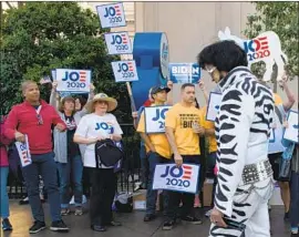  ?? Bridget Bennett AFP/Getty Images ?? E LV I S is not on the Democratic ballot in Nevada, but 13 candidates are, including six who have dropped out. Nearly 75,000 Democrats voted early, party officials say.