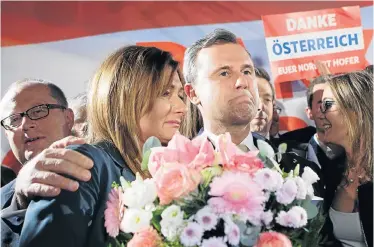  ?? Picture: AFP ?? CLOSE CALL: Austria’s Norbert Hofer with his wife, Verena, following his narrow presidenti­al race defeat