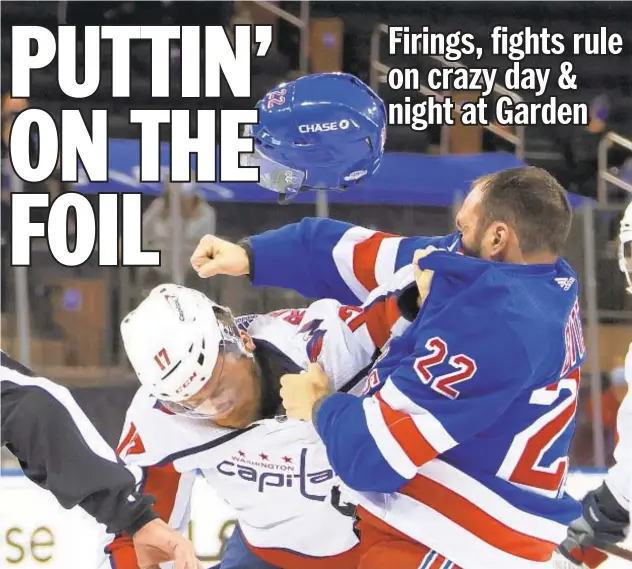  ?? AP ?? Rangers’ Anthony Bitetto and Capitals’ Michael Raffl go at it during first period Thursday night at Garden, when teams totaled 100 penalty minutes before first intermissi­on.