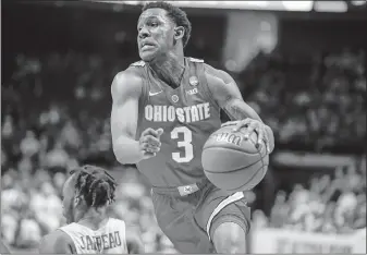  ?? [IAN MAULE/TULSA WORLD] ?? Ohio State’s C.J. Jackson drives past Houston’s Dejon Jarreau.