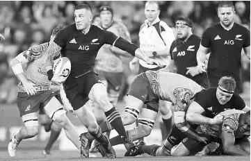  ??  ?? Sonny Bill Williams of New Zealand’s All Blacks (front left) runs at the Australian defence during the Bledisloe Cup internatio­nal rugby match between Australia and New Zealand at Suncorp Stadium in Brisbane. — AFP photo
