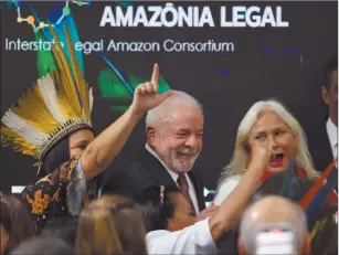  ?? Photo: Nampa/AFP ?? Cheer… Brazilian president-elect Luiz Inacio Lula da Silva smiles next to singer Fafa de Belem during a discussion about the Amazon Forest at the COP27 climate conference in Egypt on 16 November 2022.