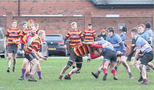  ??  ?? ●●Shane Ennis thwarts a Wilmslow attack