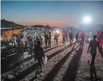  ?? NARIMAN EL-MOFTY THE ASSOCIATED PRESS ?? Tigray people, who fled the conflict in Ethiopia’s Tigray region, walk at Umm Rakouba refugee camp in Qadarif, eastern Sudan.
