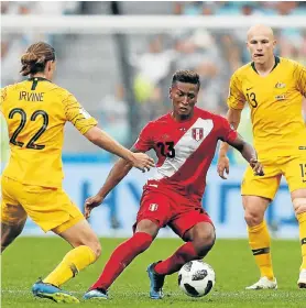  ?? Picture: AFP/ ADRIAN DENNIS ?? TAKING THE GAP: Peru midfielder Pedro Aquino vies for the ball with Australia midfielder Jackson Irvine, left, and midfielder Aaron Mooy during their Group C match in Sochi, Russia, yesterday