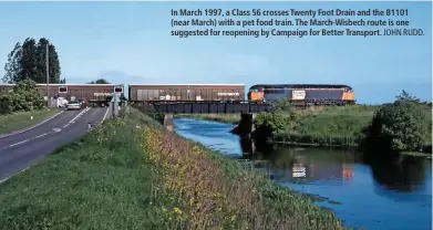  ?? JOHN RUDD. ?? In March 1997, a Class 56 crosses Twenty Foot Drain and the B1101 (near March) with a pet food train. The March-Wisbech route is one suggested for reopening by Campaign for Better Transport.