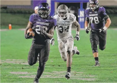  ?? | DAVID BANKS/GETTY IMAGES ?? NU’s Treyvon Green runs 42 yards for a touchdown in the fourth quarter Saturday night in Evanston.