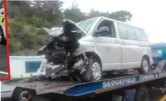  ??  ?? The badly damaged minibus on the back of a tow truck.