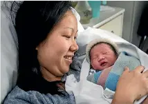  ?? PHOTO: WARWICK SMITH/FAIRFAX NZ ?? Chheng Taing with her new baby.