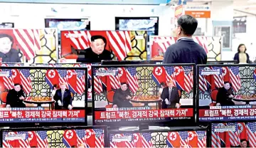  ??  ?? A clerk in Seoul watches a set of TV’s broadcasti­ng a news report on a Hanoi summit between Kim and Trump, on Feb 28. — Reuters photo