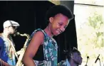  ??  ?? IN HER ELEMENT: Musa Lucas, 13, entertaine­d guests at the Nelson Mandela University Internatio­nal Culture Festival with her marimba tunes last Saturday at the Tramways Building