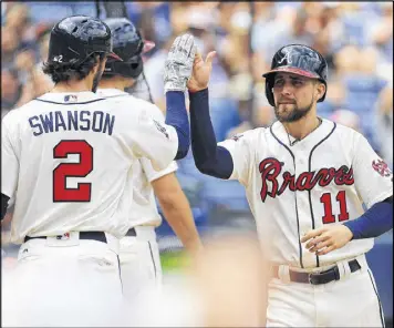  ?? DANIEL SHIREY / GETTY IMAGES ?? If the Braves and their fans are lucky, Ender Inciarte (11) and Dansby Swanson should be celebratin­g in Atlanta for the next decade.
