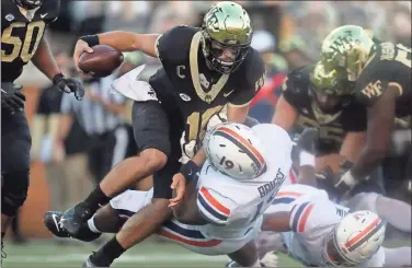  ?? ♦ Virginia Athletics/ TNS ?? Wake Forest’s Sam Hartman, one of the highestreg­arded QBS in the ACC, is out indefinite­ly with an undisclose­d medical condition not related to football.