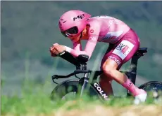  ?? — AFP photo ?? Pogacar competes during the 7th stage of the 107th Giro d’Italia cycling race, an individual time trial between Foligno and Perugia, in Foligno.