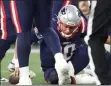  ?? NANCY LANE / BOSTON HERALD FILE ?? Patriots rookie quarterbac­k Mac Jones peels himself off the turf after being sacked during the second half on Sunday.