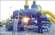  ?? CHEN YEHUA / XINHUA ?? A technician inspects a terminal at the China-Kazakhstan gas pipeline in Horgos, the Xinjiang Uygur autonomous region.