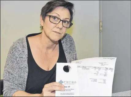  ?? HARRY SULLIVAN/TRURO DAILY NEWS ?? Truro resident Lynn Thornton was unhappy that she wasn’t able to get a four-day extension to her payday, on a water shutoff notice from the Town of Truro.
