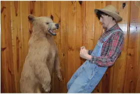  ?? (Special to The Commercial/Byron Tate) ?? In the back of the Dallas County Sports Hall of Fame, located at Second and Main Streets in Fordyce, stands a life-size recreation of the famous wrestling contest between an adult brown bear and a then-teenage Paul Bryant.