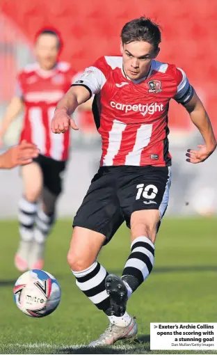  ?? Dan Mullan/Getty Images ?? > Exeter’s Archie Collins opens the scoring with a stunning goal