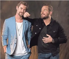  ?? DAN MACMEDAN/USA TODAY ?? Hemsworth and Pratt have much in common. Onscreen, they’re superstars and superheroe­s; offscreen, they’re just a couple of dads.