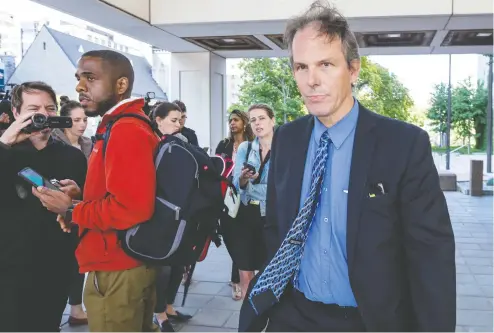  ?? ERROL MCGIHON / POSTMEDIA NEWS ?? Senior counsel with the public prosecutio­n service, John MacFarlane, walks away from the Ottawa courthouse on Friday after addressing media
regarding charges against Cameron Ortis of Ottawa, a senior intelligen­ce officer with the RCMP.