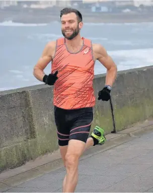  ?? TIM KALE ?? Adam Bowden striding to victory in a Porthcawl Parkrun record time