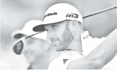  ??  ?? Johnson watches his shot from the 17th tee during a practice round at The 147th Open golf Championsh­ip at Carnoustie, Scotland. — AFP photo