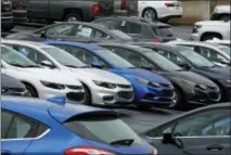  ?? THE ASSOCIATED PRESS ?? Chevrolet cars are parked on the lot of a dealer in Pittsburgh.