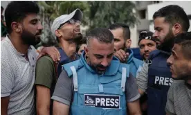  ?? October. Photograph: Haitham Imad/EPA ?? Journalist­s react after two Palestinia­n colleagues were killed in an Israeli strike in Gaza City on 10