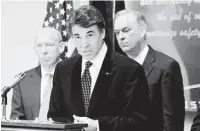  ?? Houston Chronicle file ?? In the effort to help, Gov. Rick Perry, center, found able allies in Houston Mayor Bill White, left, and Harris County Judge Robert Eckels.