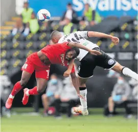  ??  ?? Ben Cabango gets the better of a challenge with Birmingham’s Jeremie Bela.