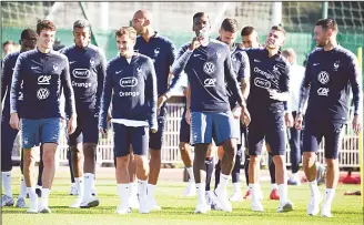  ??  ?? From left: France’s defender Benjamin Pavard, forward Antoine Griezmann, midfielder Paul Pogba, defender Lucas Hernandez and goalkeeper Hugo Lloris arrive for a training session in Clairefont­aine en Yvelines on Oct 8, ahead the upcoming friendly football match against Iceland and the Nations League match againstGer­many. (AFP)