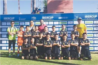  ?? Courtesy of Stopia Korea ?? Youth sports education agency Stopia Korea CEO Cho Woo-tak, first from left, poses with youth footballer­s during the Ibercup Internatio­nal Youth Football Tournament in Costa Del Sol, Spain, last July.