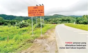  ??  ?? TANDA amaran yang diletakkan beberapa meter dari lokasi kejadian.