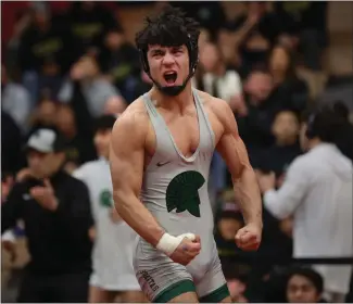  ?? KARL MONDON — STAFF PHOTOGRAPH­ER ?? De La Salle's Atri Feizi celebrates his double-overtime victory over Jayson Victoria of Granada in the championsh­ip match of the 138-pound division of the NCS boys wrestling championsh­ips in Union City on Saturday. For complete coverage online, go to mercurynew­s.com/high-school-sports.