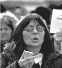  ?? DARKO VOJINOVIC/AP ?? Mirjana Novokmet speaks last week at a protest in front of the parliament building in Belgrade, Serbia. Hundreds of families suspect their babies were stolen at birth.