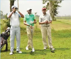  ??  ?? Leading Nigeria pro golfer, Oche Odoh (M) with other golfers before tee-off during a tournament.