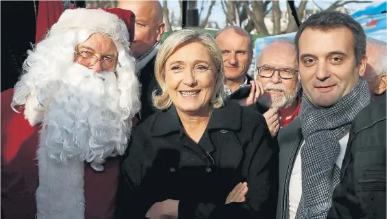  ?? AP ?? Figura. Marine Le Pen, líder del ultranacio­nalista Frente Nacional francés, ayer, en un mercado navideño en los Campos Eliseos, en París.