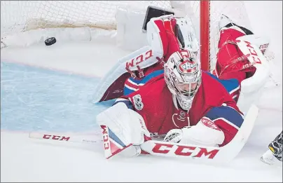  ?? CP PHOTO ?? Montreal Canadiens goalie Carey Price (31) is beaten by a shot from New York Rangers’ Mika Zibanejad, not shown, during overtime Game 5 NHL Stanley Cup first round playoff hockey action in Montreal on Thursday. The Rangers beat the Canadiens 3-2 to...