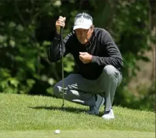  ?? Stacy Revere/Getty Images ?? Senior PGA leader Stephen Ames lines up a putt Saturday in the third round in Benton Harbor, Mich.