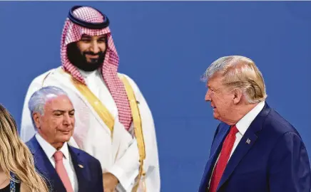  ?? Saul Loeb / AFP/Getty Images ?? President Donald Trump, Brazilian President Michel Temer, left, and Saudi Crown Prince Mohammed bin Salman take their places for a photo during the G-20 Leaders’ Summit in Buenos Aires, Argentina, last week.