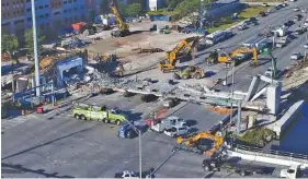  ?? THE ASSOCIATED PRESS ?? Recovery operations continue at the site of the collapsed pedestrian bridge near Florida Internatio­nal University in Miami on Saturday.