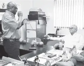  ??  ?? Minister of Industry, Commerce, Agricultur­e and Fisheries Karl Samuda (right) listens keenly as Export Complex Manager at the Montego Bay Plant Quarantine Unit and Export Centre Dalton Hastings provides him with first-hand informatio­n on how the...