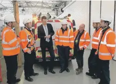  ??  ?? Simon Clarke MP talks to engineers at the Openreach training school