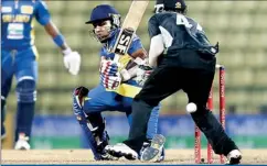  ??  ?? Mahela Jayawarden­a plays a shot during the second One Day Internatio­nal (ODI) cricket match against New Zealand in Pallekele yesterday – REUTERS