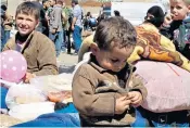  ??  ?? Syrian civilians from the war-torn Damascus suburb of Eastern Ghouta arrive in Idlib