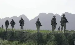  ?? COLIN PERKEL / THE CANADIAN PRESS FILES ?? Canadian soldiers on patrol in Afghanista­n in 2009. Programs to help veterans with PTSD are under strain.